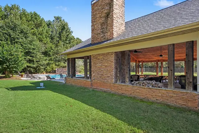 Sage Creek clubhouse porch with a stone chimney